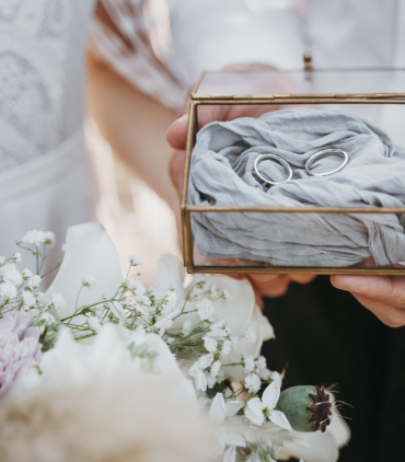 bride-groom-holding-their-rings